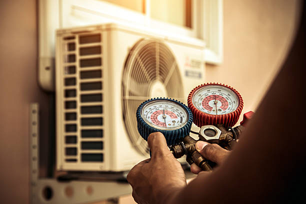Professional Air Conditioning Service technician working in Gore, OK